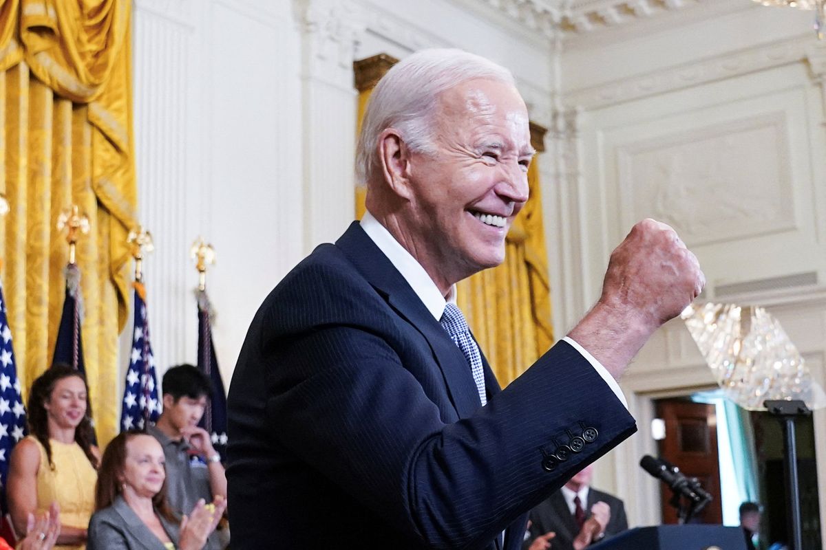 U.S. President Joe Biden gives a fist bump salute to the audience during an event to celebrate the anniversary of his signing of the 2022 Inflation Reduction Act legislation, on Aug. 16, 2023.