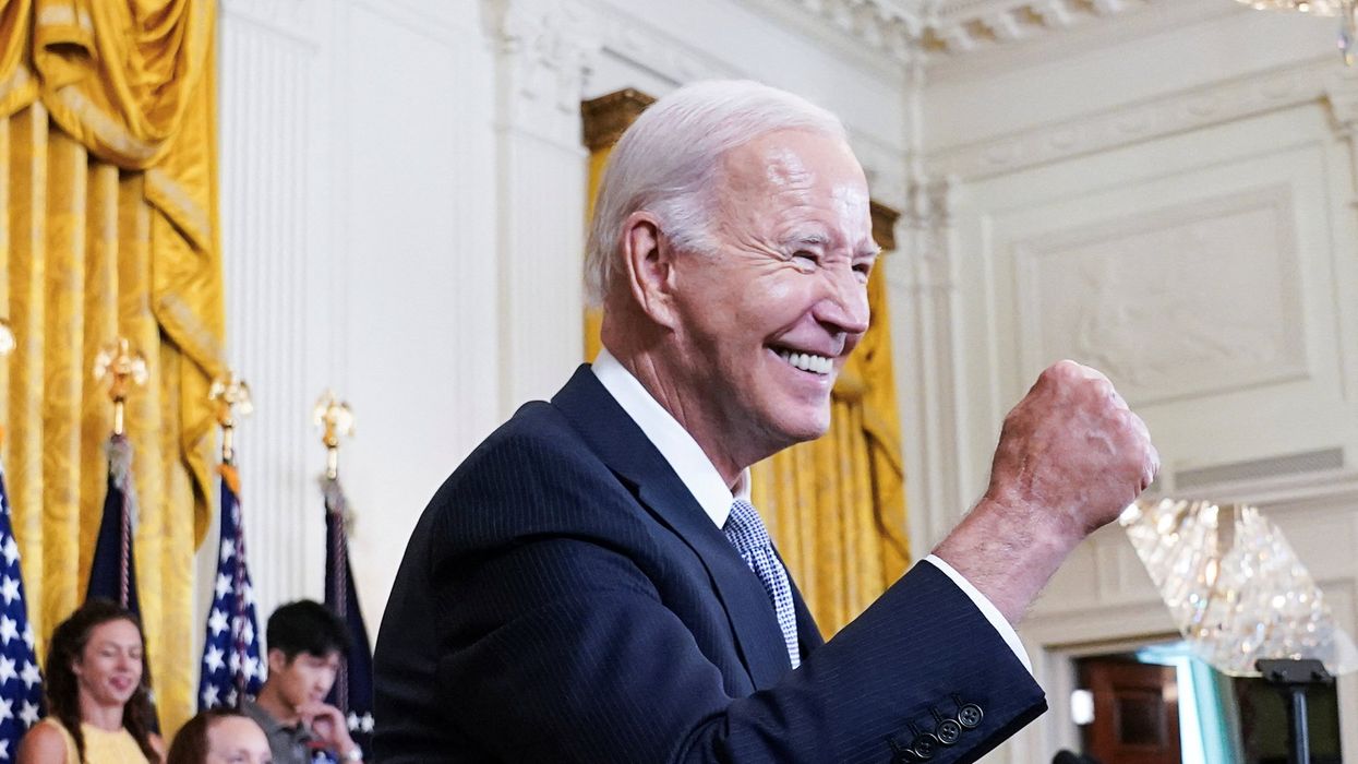 U.S. President Joe Biden gives a fist bump salute to the audience during an event to celebrate the anniversary of his signing of the 2022 Inflation Reduction Act legislation, on Aug. 16, 2023.