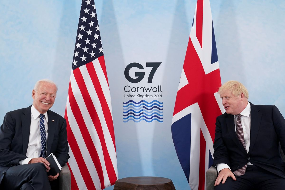 U.S. President Joe Biden laughs while speaking with Britain's Prime Minister Boris Johnson during their meeting, ahead of the G7 summit, at Carbis Bay, Cornwall, Britain June 10, 2021