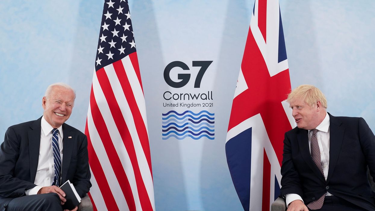 U.S. President Joe Biden laughs while speaking with Britain's Prime Minister Boris Johnson during their meeting, ahead of the G7 summit, at Carbis Bay, Cornwall, Britain June 10, 2021