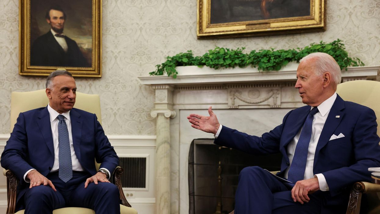 U.S. President Joe Biden SPEAKS with Iraq's Prime Minister Mustafa Al-Kadhimi during a bilateral meeting in the Oval Office at the White House in Washington, U.S., July 26, 2021.