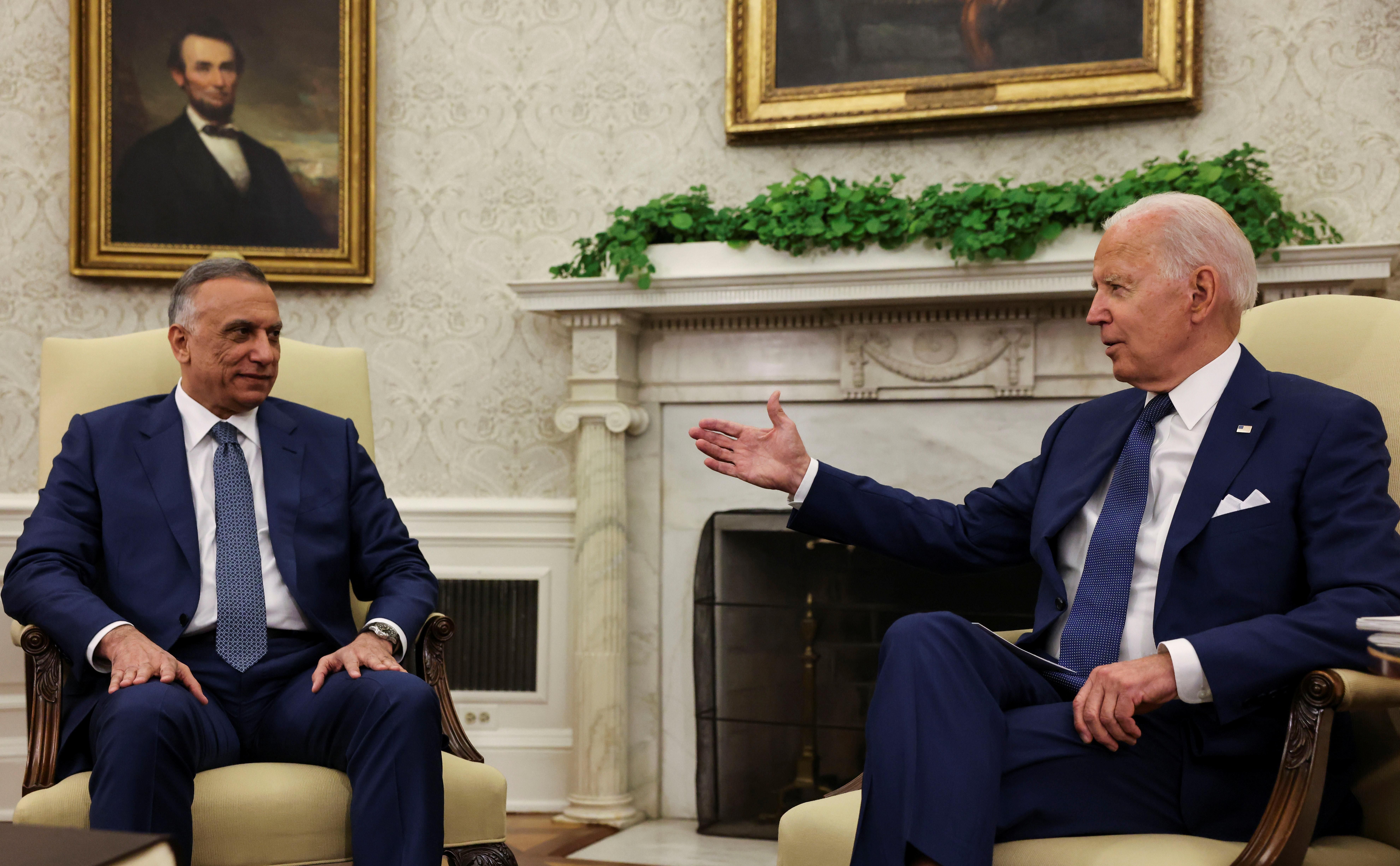 U.S. President Joe Biden SPEAKS with Iraq's Prime Minister Mustafa Al-Kadhimi during a bilateral meeting in the Oval Office at the White House in Washington, U.S., July 26, 2021.