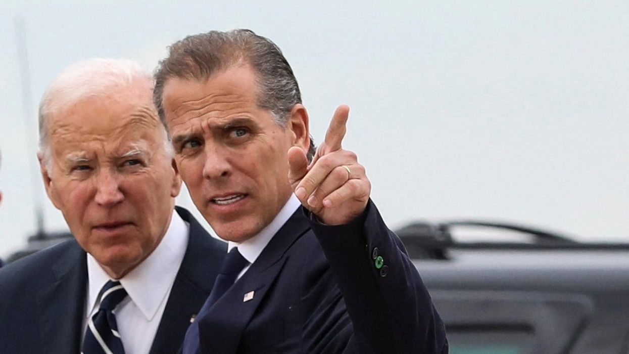 U.S. President Joe Biden stands with his son Hunter Biden, who earlier in the day was found guilty on all three counts in his criminal gun charges trial, after President Biden arrived at the Delaware Air National Guard Base in New Castle, Delaware, U.S., June 11, 2024.