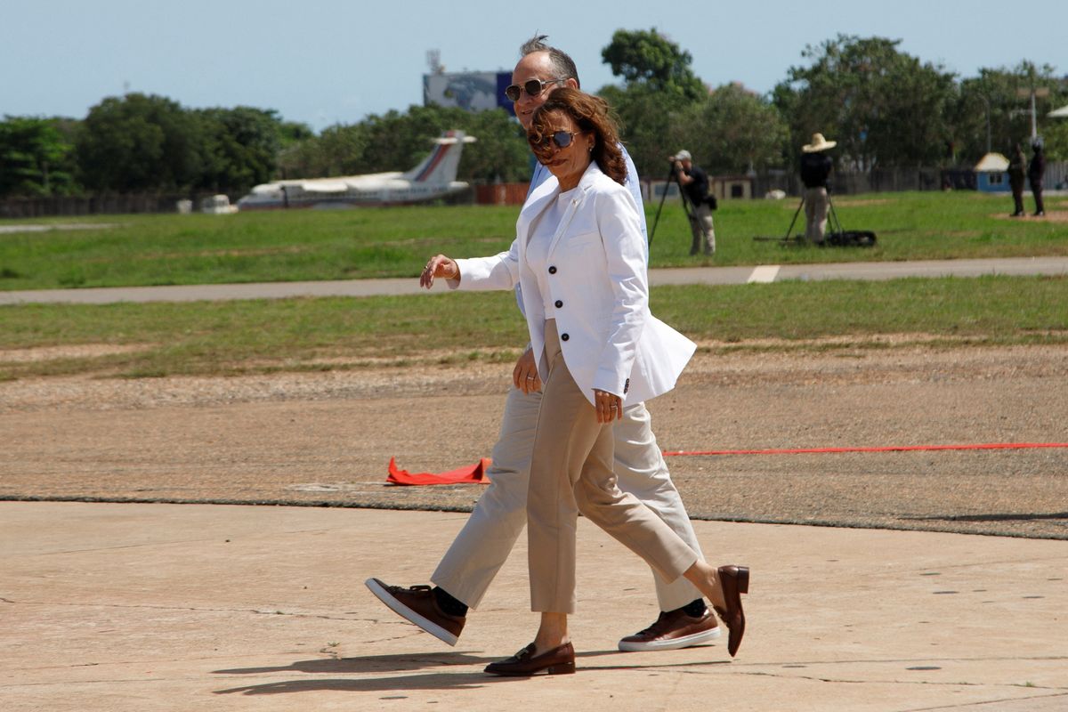 U.S. Vice President Kamala Harris and Second Gentleman Doug Emhoff walk to a helicopter on their way to Cape Coast in Accra, Ghana, Tuesday March 28, 2023.