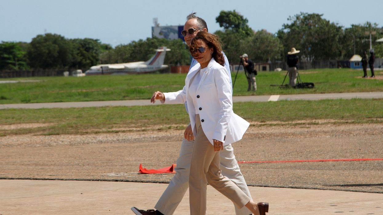 U.S. Vice President Kamala Harris and Second Gentleman Doug Emhoff walk to a helicopter on their way to Cape Coast in Accra, Ghana, Tuesday March 28, 2023.