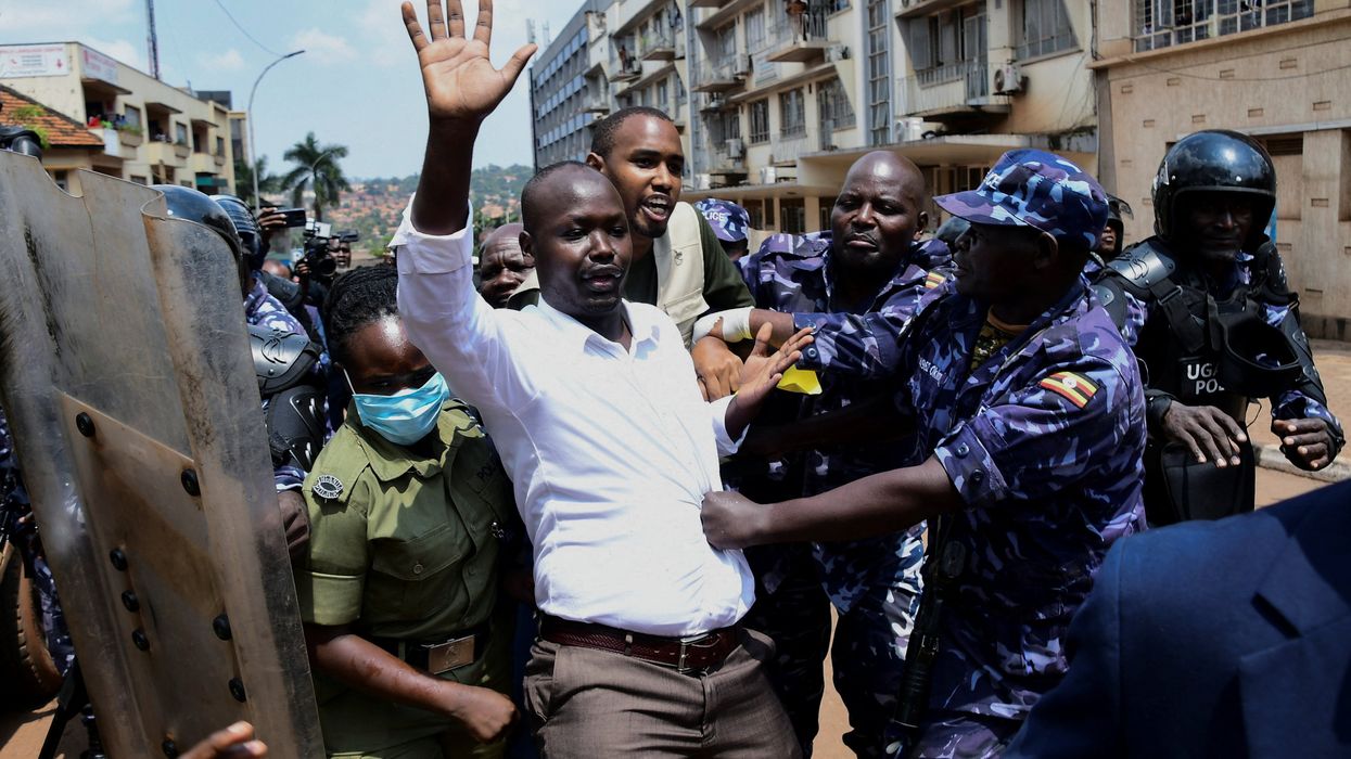 Ugandan police officers detain protestors during a rally against what the protesters say are rampant corruption and human rights abuses by the country's rulers in Kampala, Uganda July 23, 2024.