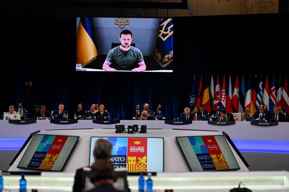 Ukraine President Volodymyr Zelensky delivers a video statement at the NATO Summit.