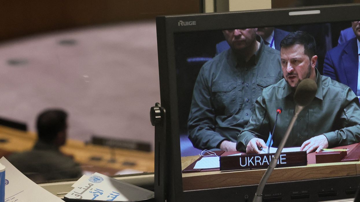 Ukraine's President Volodymyr Zelenskiy is seen on a video monitor in a booth above the United Nations Security Council floor.