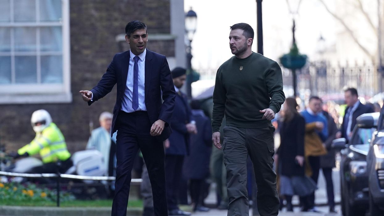 Ukraine's President Volodymyr Zelensky walks outside No. 10 Downing Street in London, ahead of a bilateral meeting with British PM Rishi Sunak.