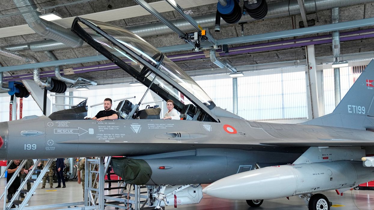 Ukrainian President Volodymyr Zelenskiy and Danish Prime Minister Mette Frederiksen sit in a F-16 fighter jet at Skrydstrup Airbase in Vojens, Denmark, August 20, 2023.