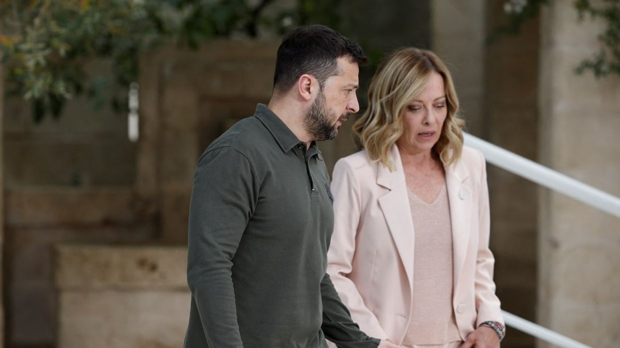 Ukrainian President Volodymyr Zelenskiy speaks with Italy's Prime Minister Giorgia Meloni, on the first day of the G7 summit at the Borgo Egnazia resort, in Savelletri, Italy, June 13, 2024.