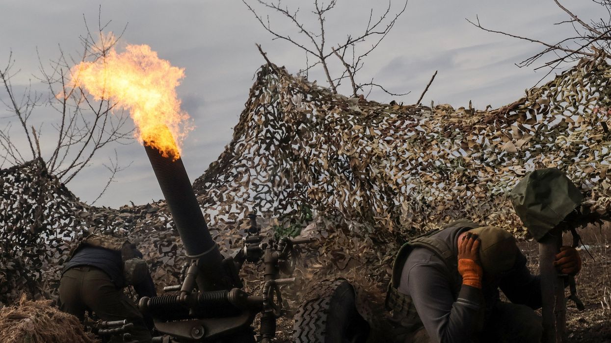 Ukrainian service members fire a mortar towards Russian troops outside the frontline town of Bakhmut, in Donetsk region, Ukraine March 6, 2023.