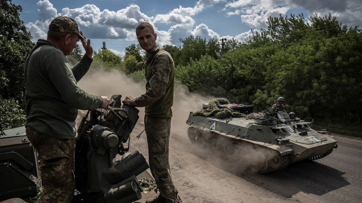 Ukrainian service members ride an Armoured Personnel Carrier, amid Russia's attack on Ukraine, near the Russian border in Sumy region, Ukraine August 11, 2024.