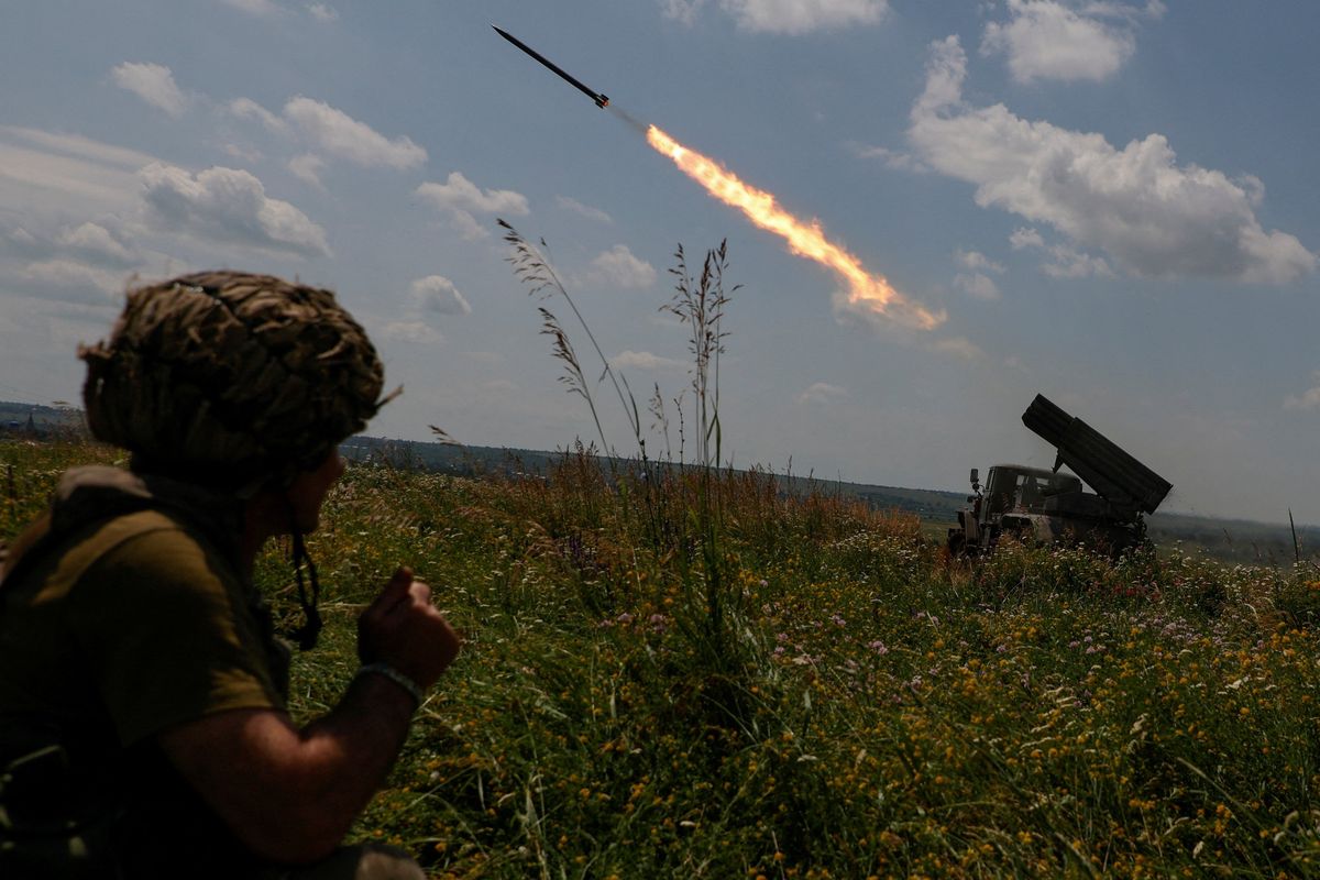 Ukrainian servicemen fire a multiple launch rocket system toward Russian troops near a front line in Zaporizhzhia region.