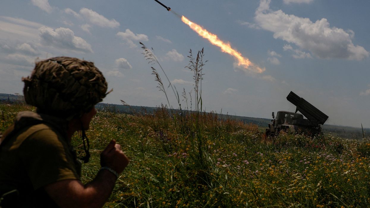 Ukrainian servicemen fire a multiple launch rocket system toward Russian troops near a front line in Zaporizhzhia region.