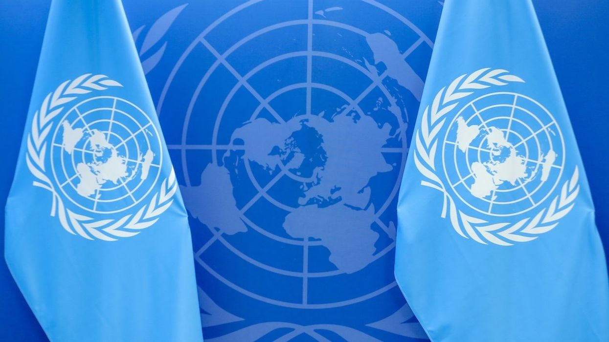 UN flags and logo.