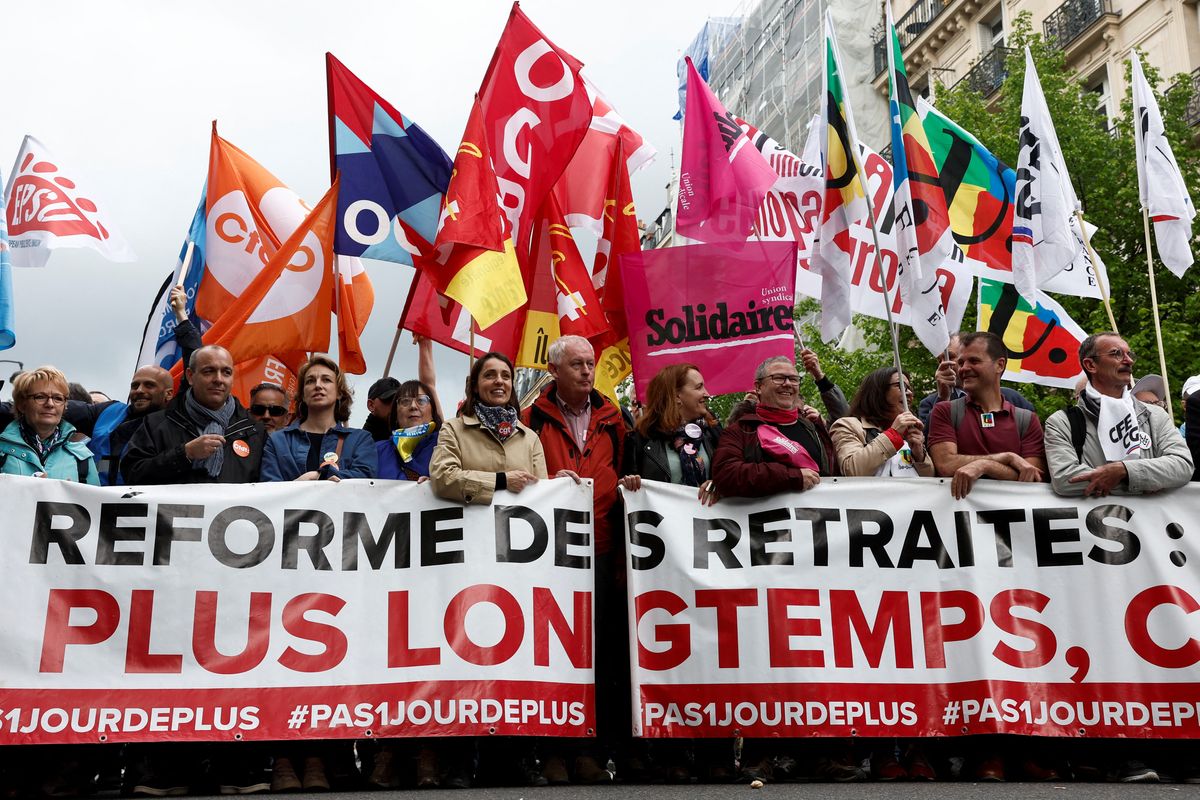 Unions attend the traditional May Day labor march to protest against the French pension reform law in Paris.