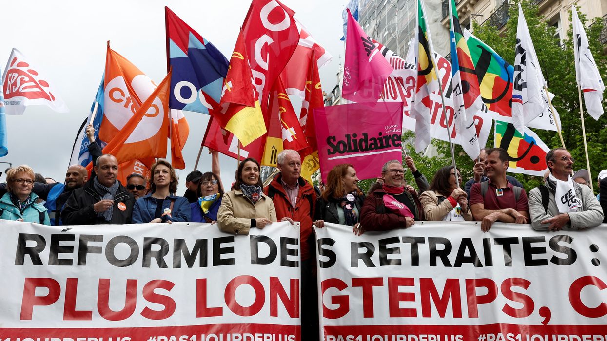Unions attend the traditional May Day labor march to protest against the French pension reform law in Paris.