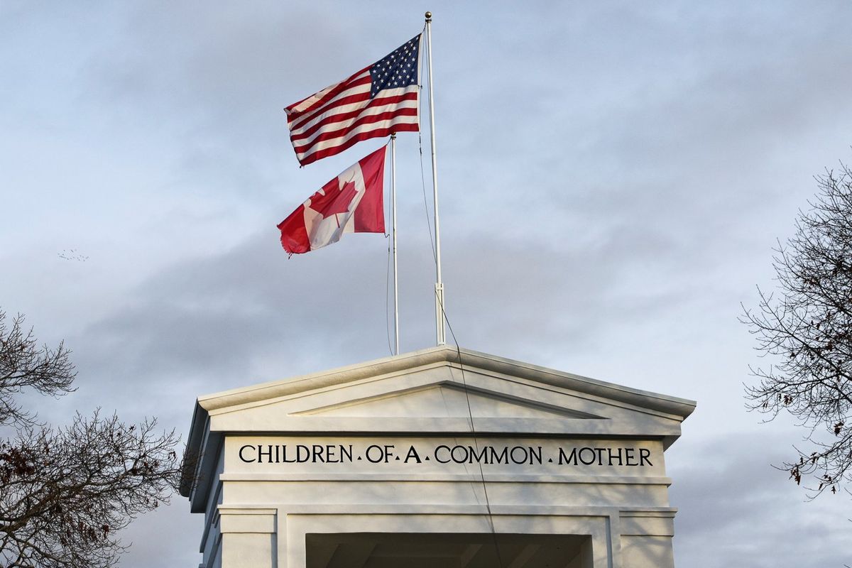 US and Canadian flags at the Peace Arch border crossing in Blaine, US state of Washington.