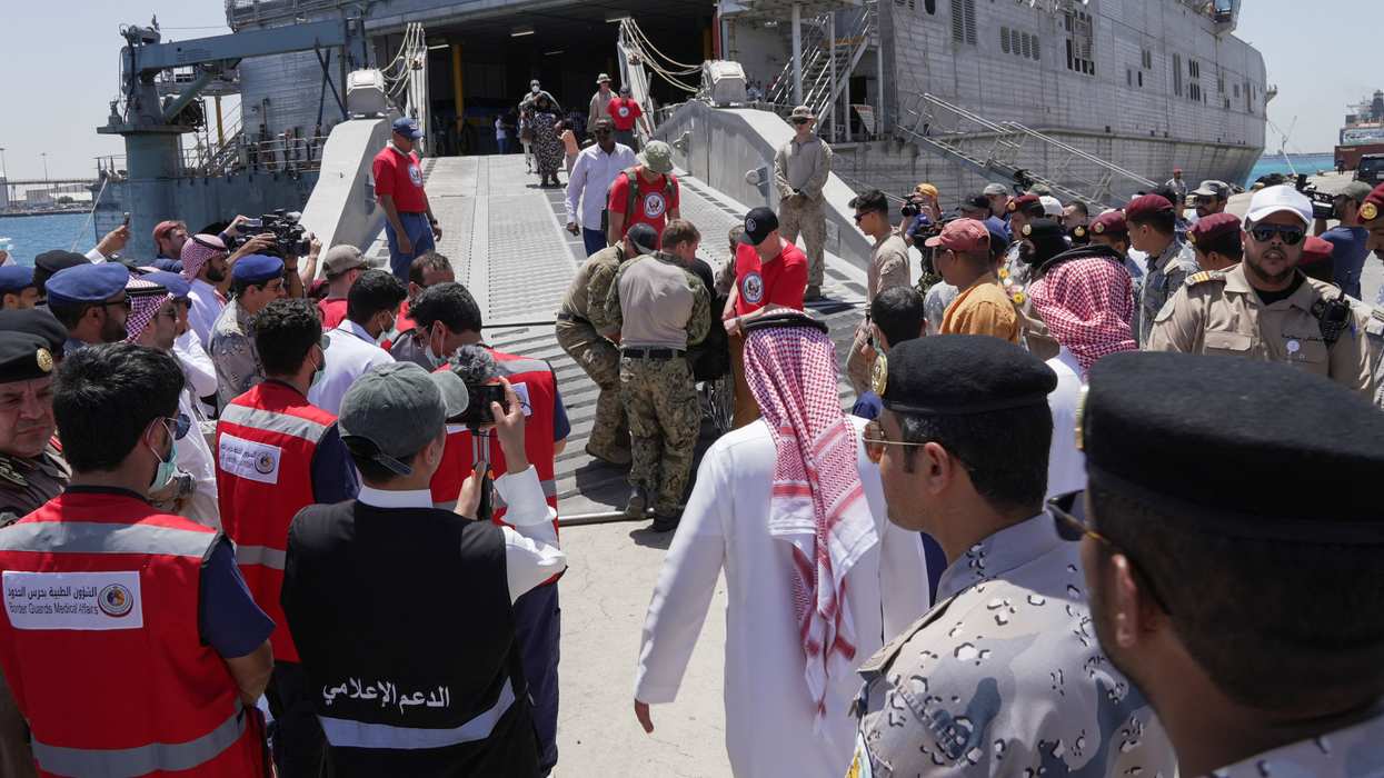 US embassy and navy officials help evacuees from Sudan disembark in Jeddah, Saudi Arabia.