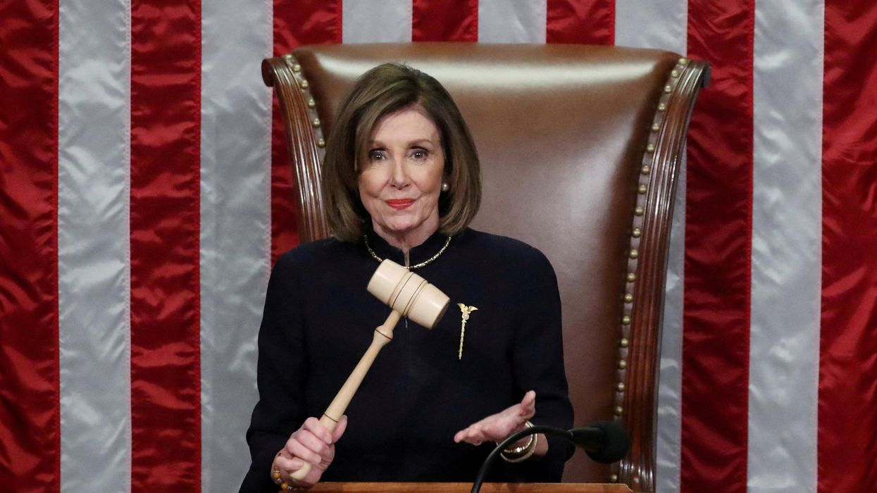 US House Speaker Nancy Pelosi (D-CA) wields the gavel as she presides over the first impeachment of President Donald Trump.