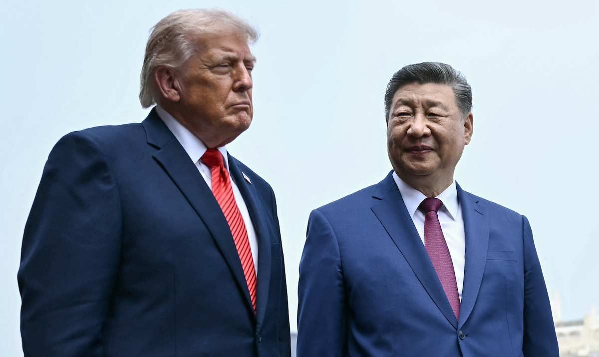 US President Donald Trump and China's President Xi Jinping talking in Beijing, China.