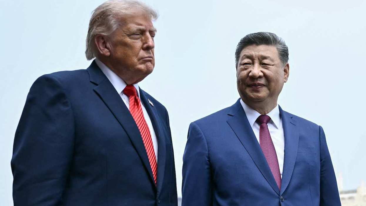 US President Donald Trump and China's President Xi Jinping talking in Beijing, China.