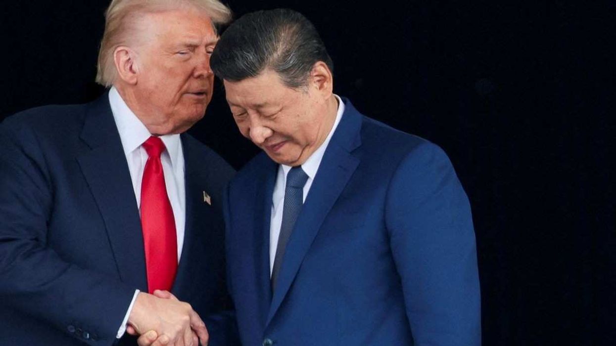 US President Donald Trump and Chinese President Xi Jinping talk in Busan, South Korea, on October 30, 2025.