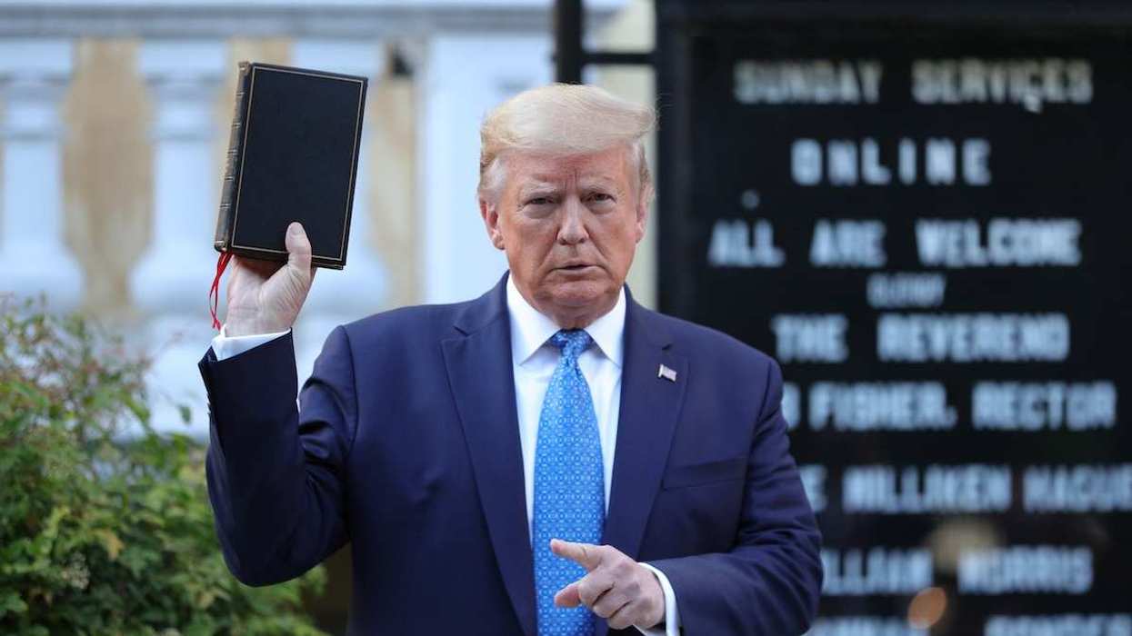 US President Donald Trump holds up a Bible in front of St. John's Episcopal Church in Washington, D.C., USA, on June 1, 2020.
