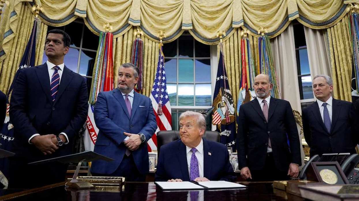 US President Donald Trump listens to a question from a reporter prior to signing an executive order on AI, in the Oval Office at the White House in Washington, D.C., USA, on December 11, 2025.