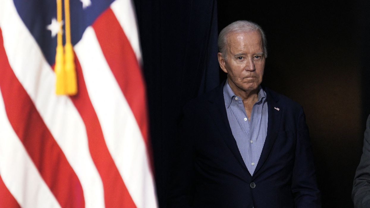 US President Joe Biden and an American flag