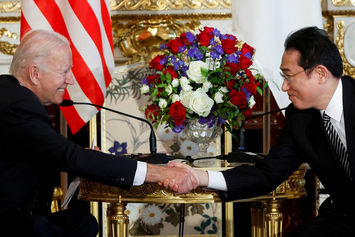US President Joe Biden and Japan's Prime Minister Fumio Kishida shake hands as they attend a bilateral meeting at Akasaka Palace in Tokyo.