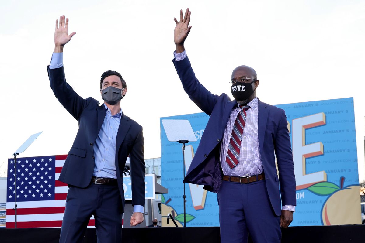 US senators-elect Jon Ossoff and Raphael Warnock campaign at a rally ahead of runoff elections in Atlanta, Georgia. Reuters