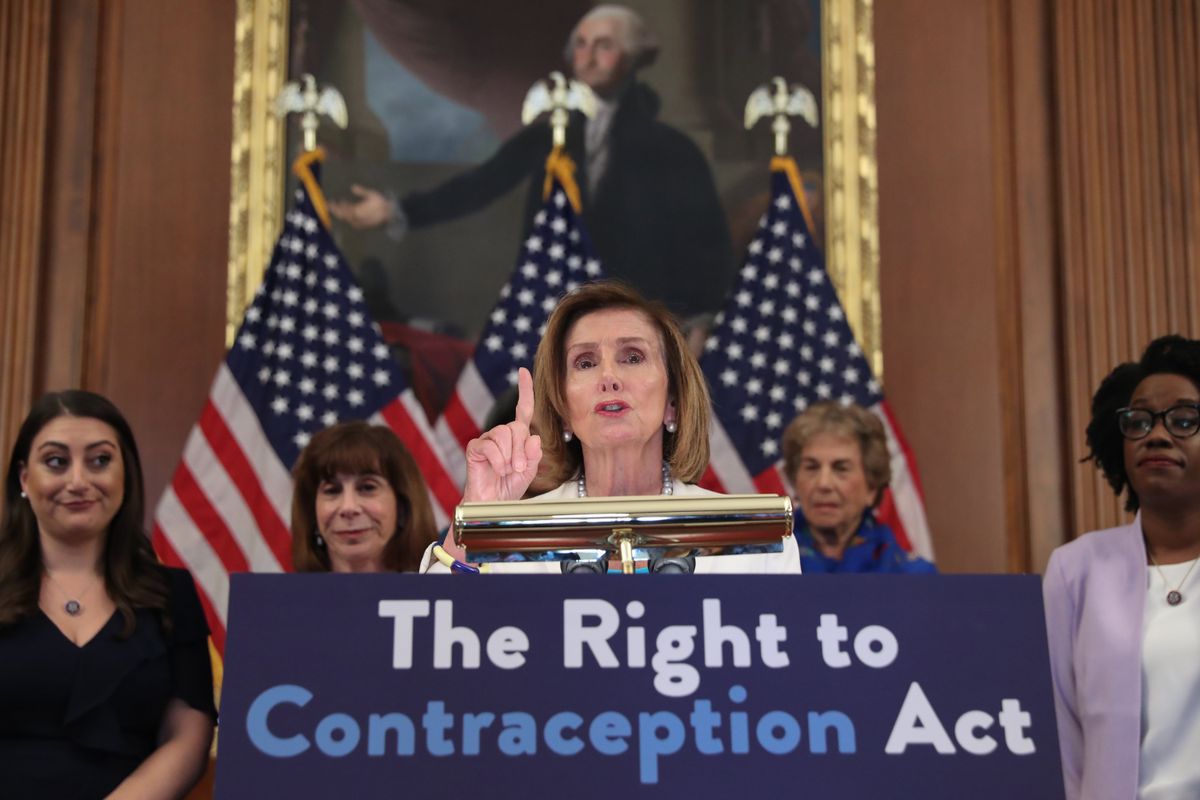 US Speaker of the House Nancy Pelosi (C) participates in a press event with other House Democratic womenn