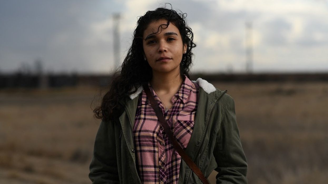 Valeria Murguia, 21, a university student, poses for a photograph in a field near her home in McFarland, California, U.S., December 17, 2020.
