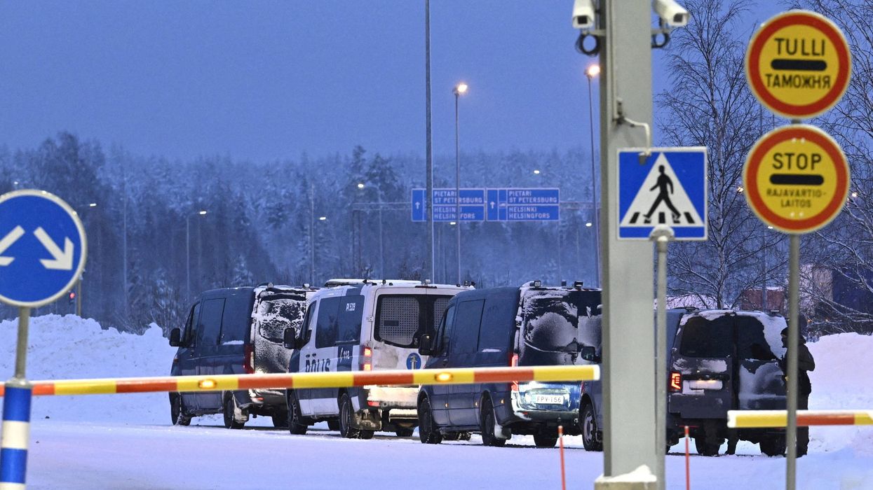 Vehicles of Finnish police are seen parked at the re-opened Vaalimaa border checkpoint between Finland and Russia in Virolahti, Finland, on Dec. 14, 2023.