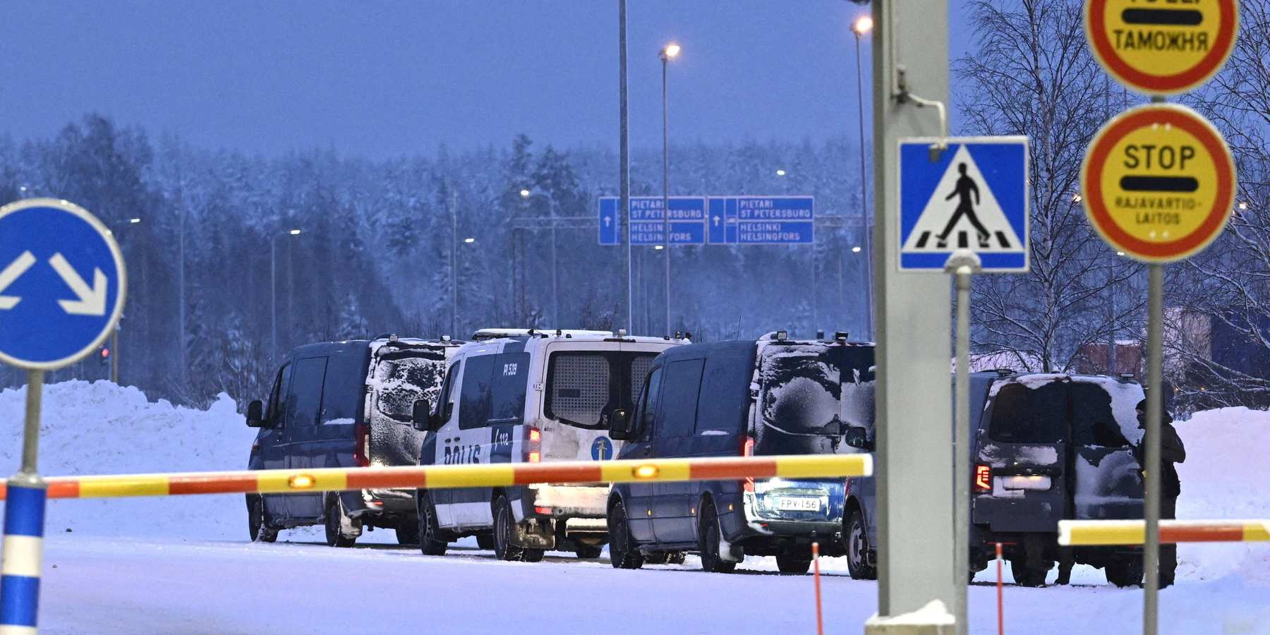 Vehicles of Finnish police are seen parked at the re-opened Vaalimaa border checkpoint between Finland and Russia in Virolahti, Finland, on Dec. 14, 2023.