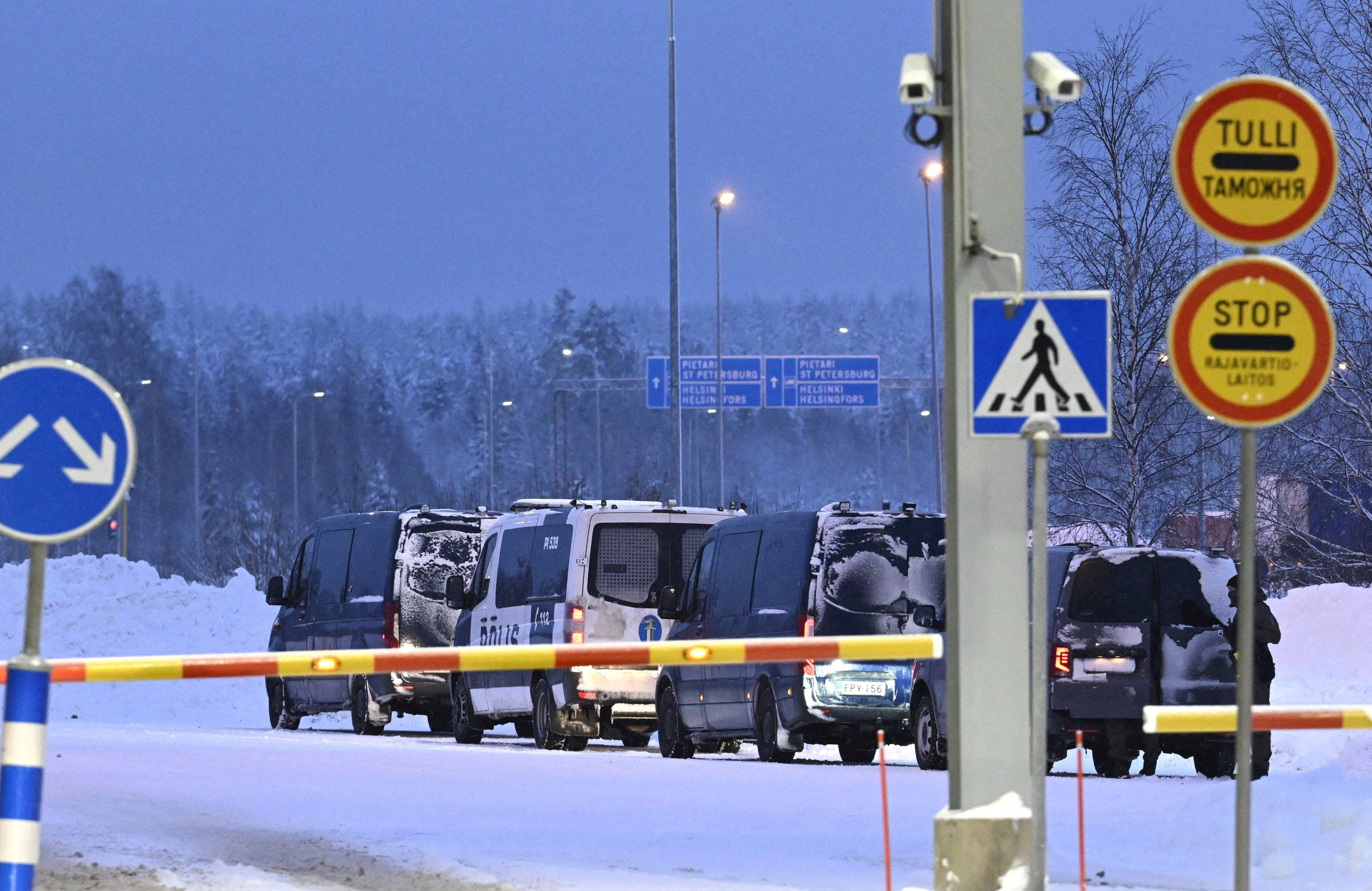 Vehicles of Finnish police are seen parked at the re-opened Vaalimaa border checkpoint between Finland and Russia in Virolahti, Finland, on Dec. 14, 2023.
