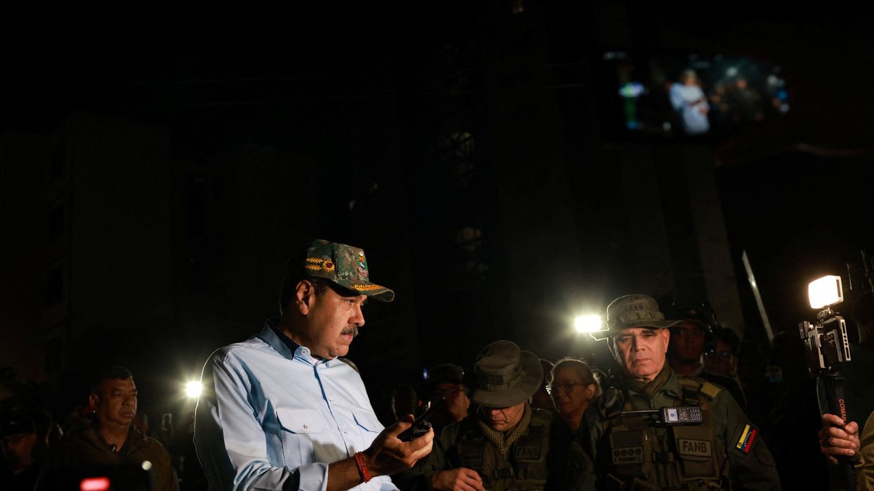 Venezuela's President Nicolas Maduro stands next to members of the armed forces, on the day he says that his country would deploy military, police and civilian defenses at 284 "battlefront" locations across the country, amid heightened tensions with the U.S., in La Guaira, Venezuela, September 11, 2025.
