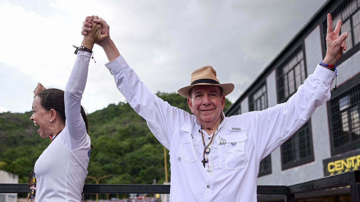 Venezuelan opposition presidential candidate Edmundo Gonzalez and Venezuelan opposition leader Maria Corina Machado greet supporters during a campaign rally for the presidential election in Valencia, Carabobo State, Venezuela, July 13, 2024.