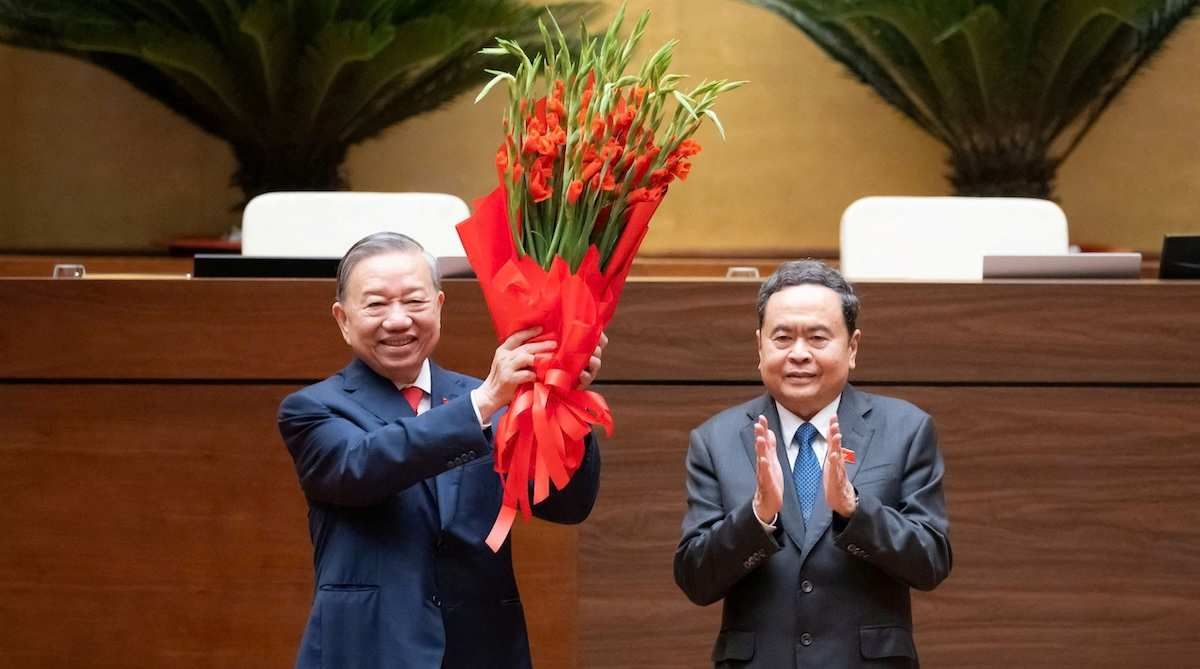 Vietnam's Communist Party General Secretary To Lam receives a bouquet from National Assembly Chairman Tran Thanh Man after taking his oath as Vietnam's President in Hanoi, Vietnam, April 7, 2026.