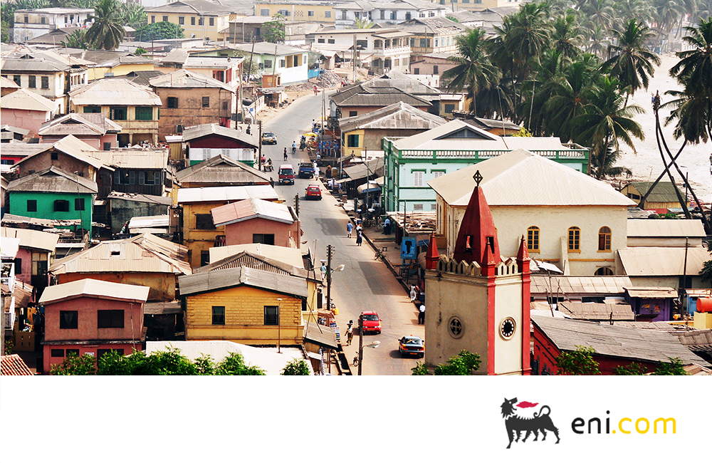 View of a street lined with colorful buildings in Ghana