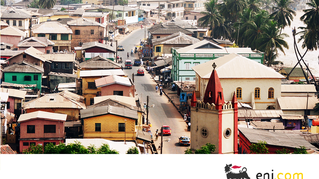 View of a street lined with colorful buildings in Ghana