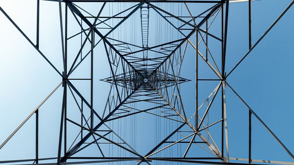 View of an energy grid tower from the bottom