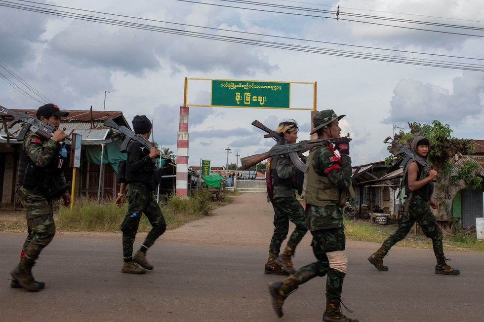 Volunteer members of Karenni insurgent forces walk in Moe Bye in Kayah State, Myanmar November 12, 2023. 