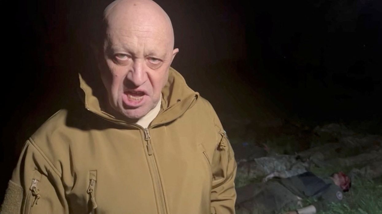 Wagner Group founder Yevgeny Prigozhin speaks next to the bodies of what he says are Wagner fighters killed in Ukraine.