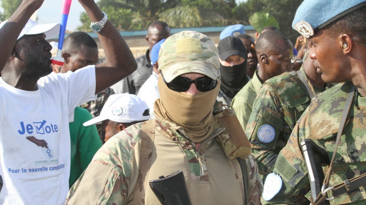 Wagner Group guards are seen around CAR President Faustin-Archange Touadera during the referendum campaign in Bangui.