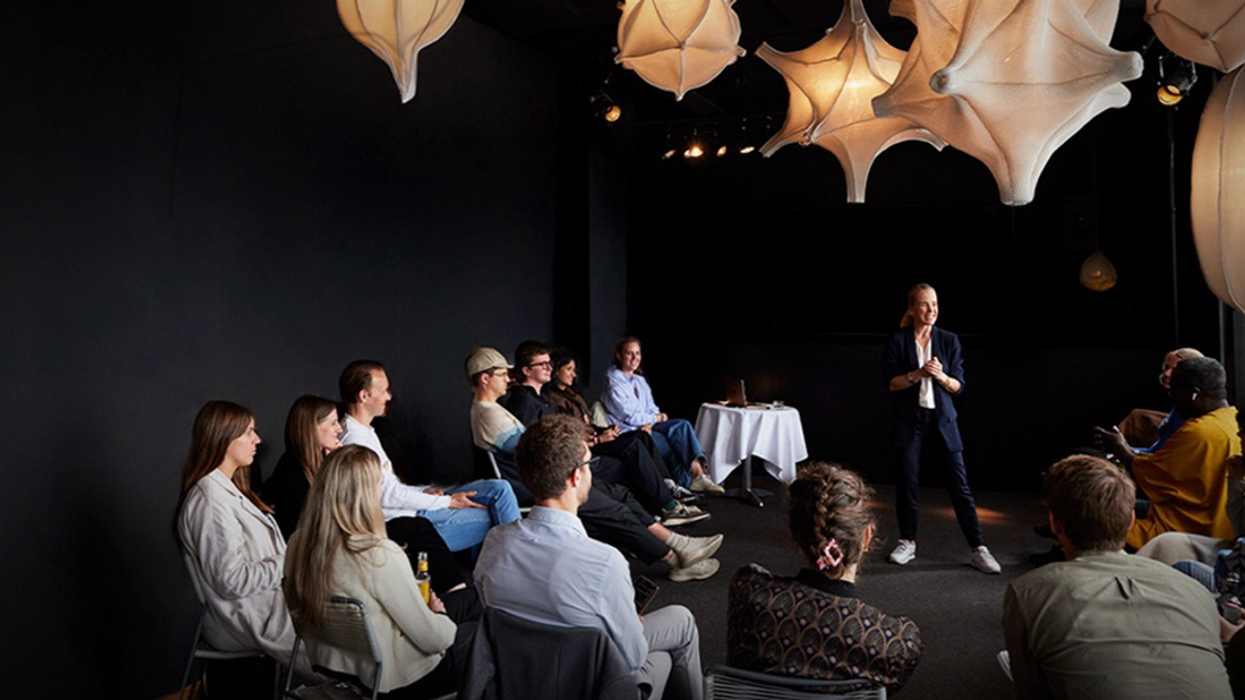 Woman speaking to a group of people