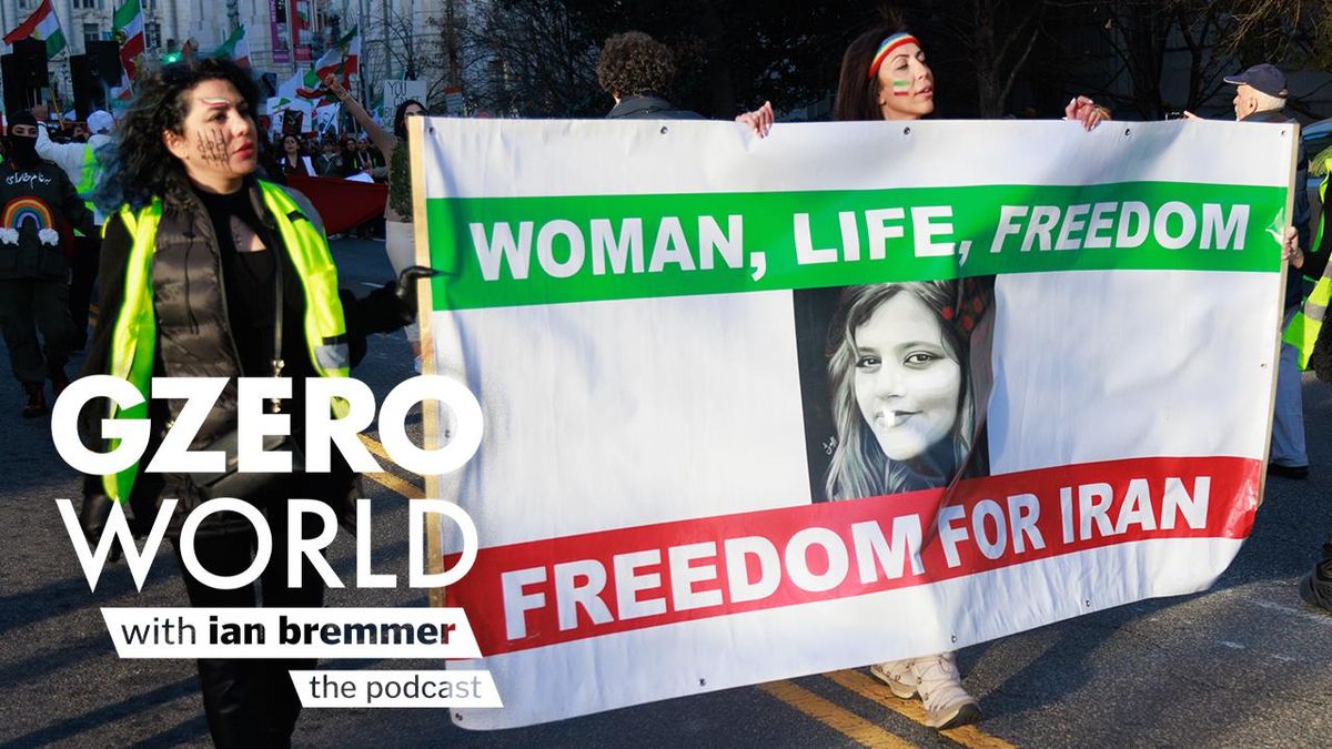 Women at a protest carrying a banner that reads "Woman, Life, Freedom for Iran" | GZERO World with Ian Bremmer - the podcast