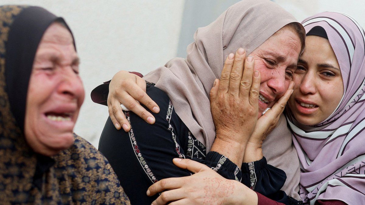 ​Women mourn near the bodies of Palestinians killed in Israeli strikes in Rafah, in the southern Gaza Strip, April 21, 2024.